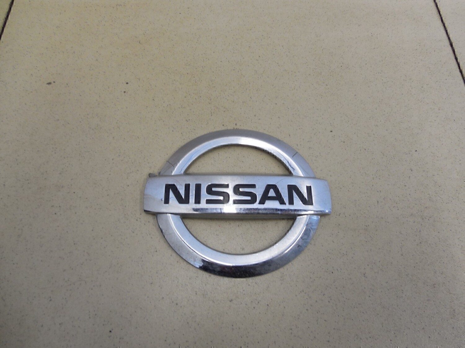 Эмблема на крышку багажника NISSAN Almera (G15) 2013>