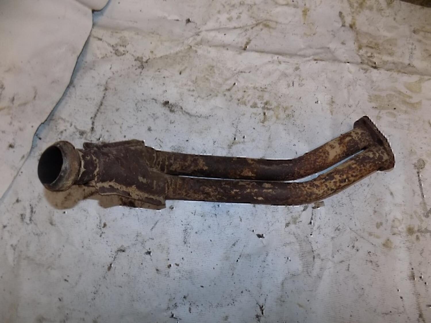 Приемная труба глушителя