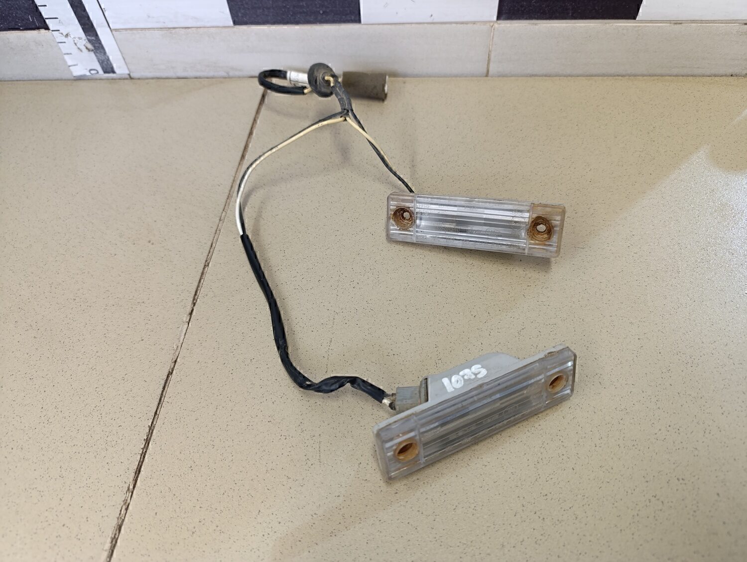 Фонарь подсветки номера Chevrolet Aveo (T200) 2003-2008