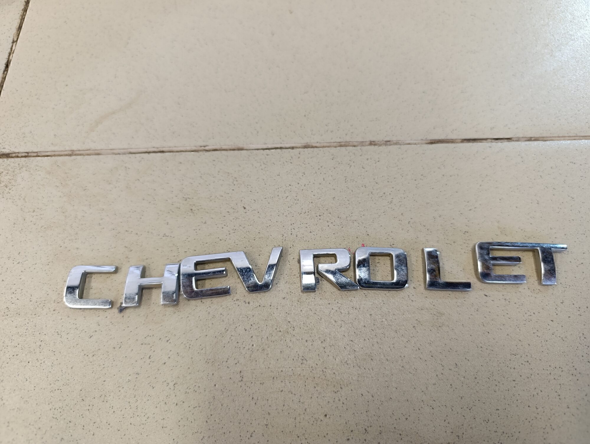 Эмблема на крышку багажника Chevrolet Aveo (T250) 2005-2011