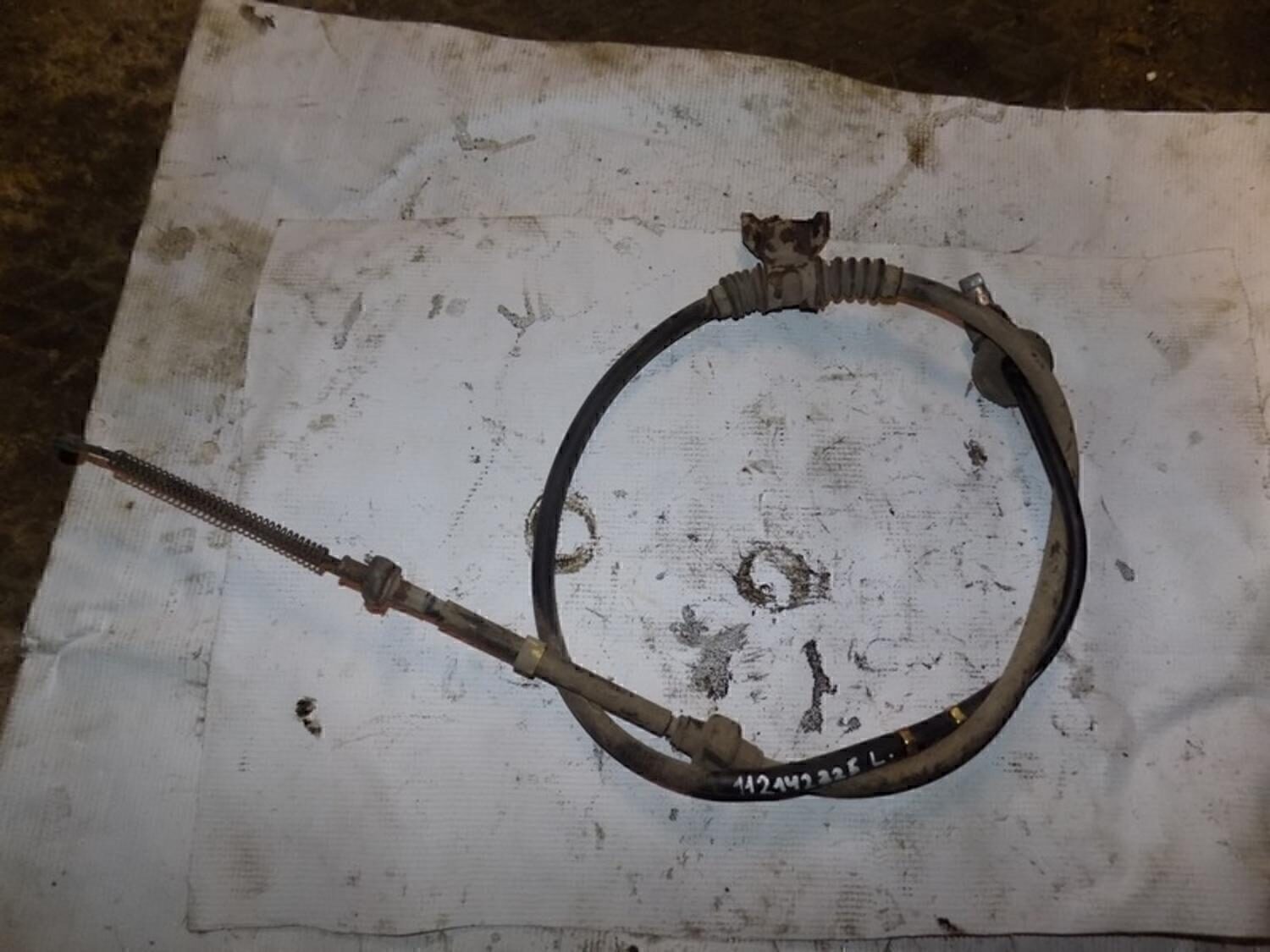 Трос стояночного тормоза левый MITSUBISHI Lancer Cedia 2000-2003