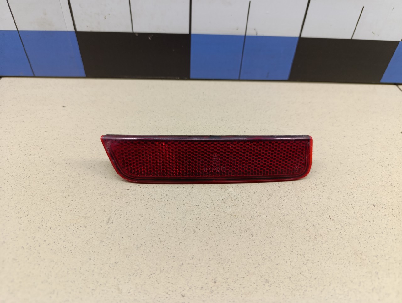 Отражатель в бампер задний левый RENAULT Duster 2012>