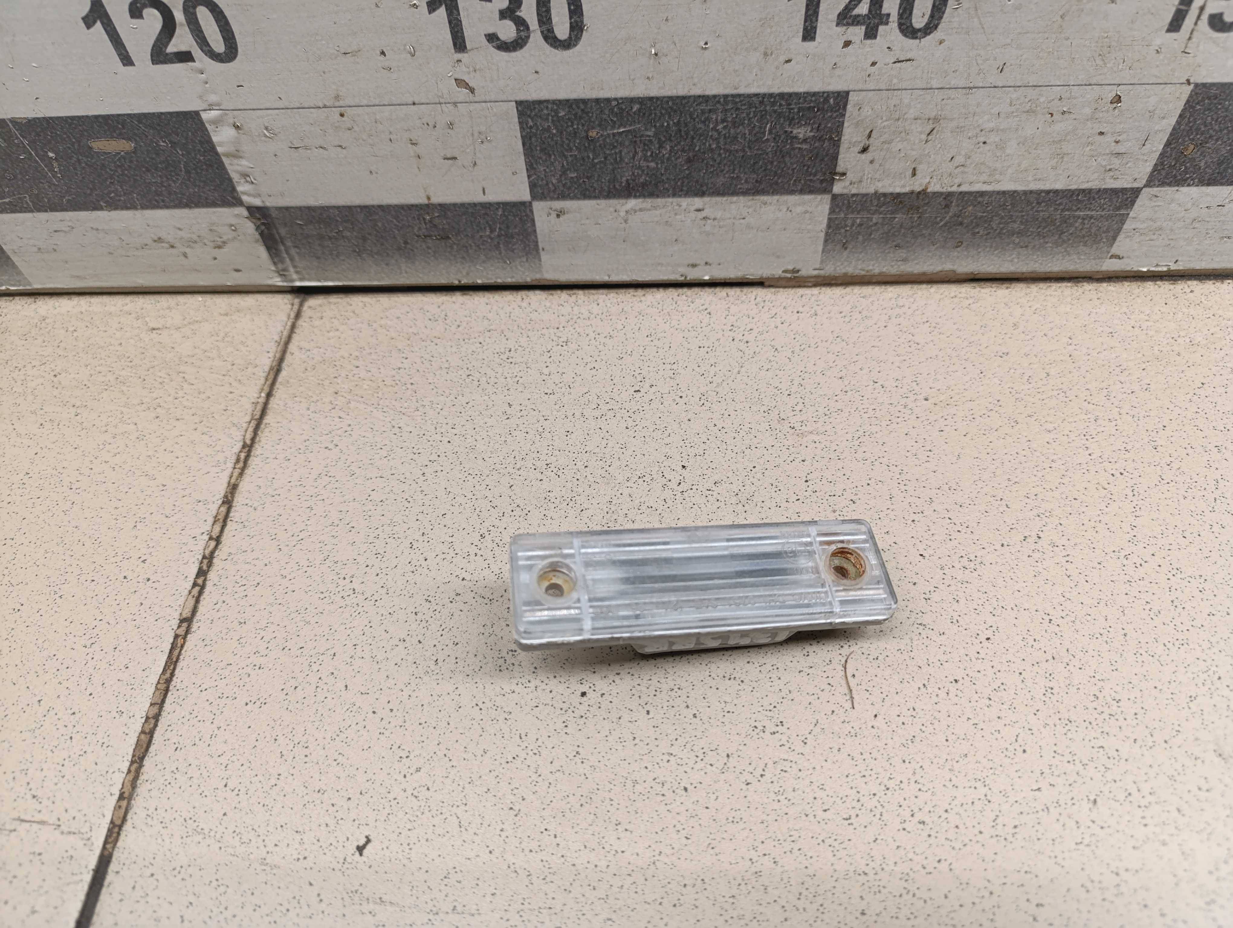 Фонарь подсветки номера Chevrolet Aveo (T200) 2003-2008